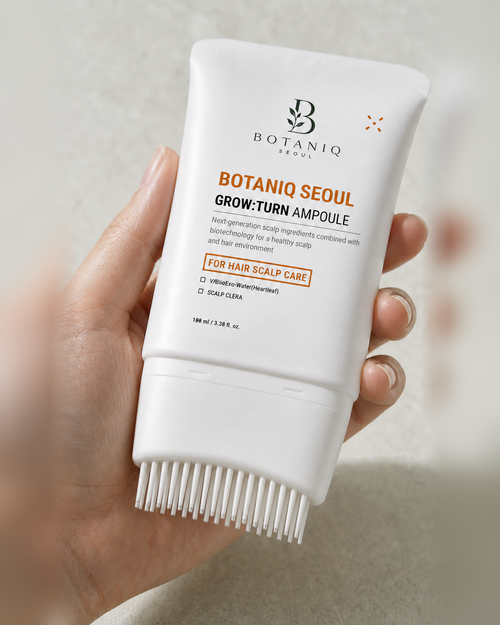 Close view of the Hairfoli serum tube and integrated flexible brush